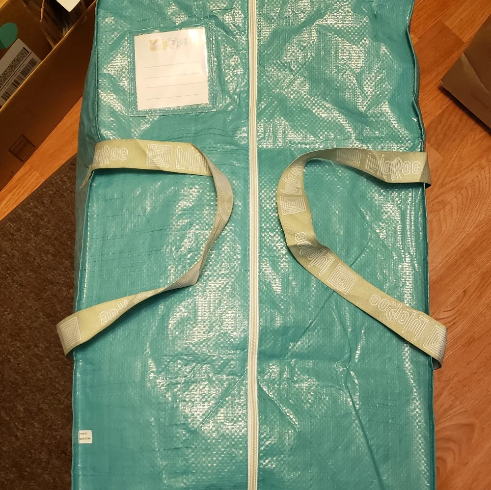 #3 - Garment bag - large. New in package. Never used. Heavy duty material.